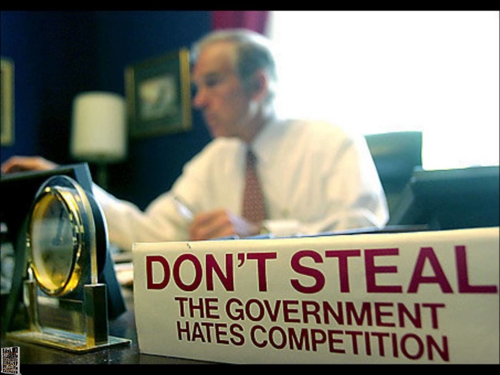 Ron Paul - Former Congressman with Do Not Steal - The Government hates competition sign on his desk. 